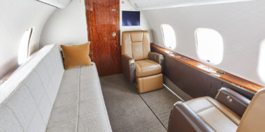 Global 5000 Interior - Aft cabin with chairs and couch