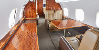 Global 5000 Interior - Facing Aft with tables out and long side table to the left